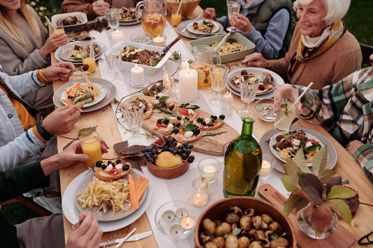 People sharing a meal around a long table