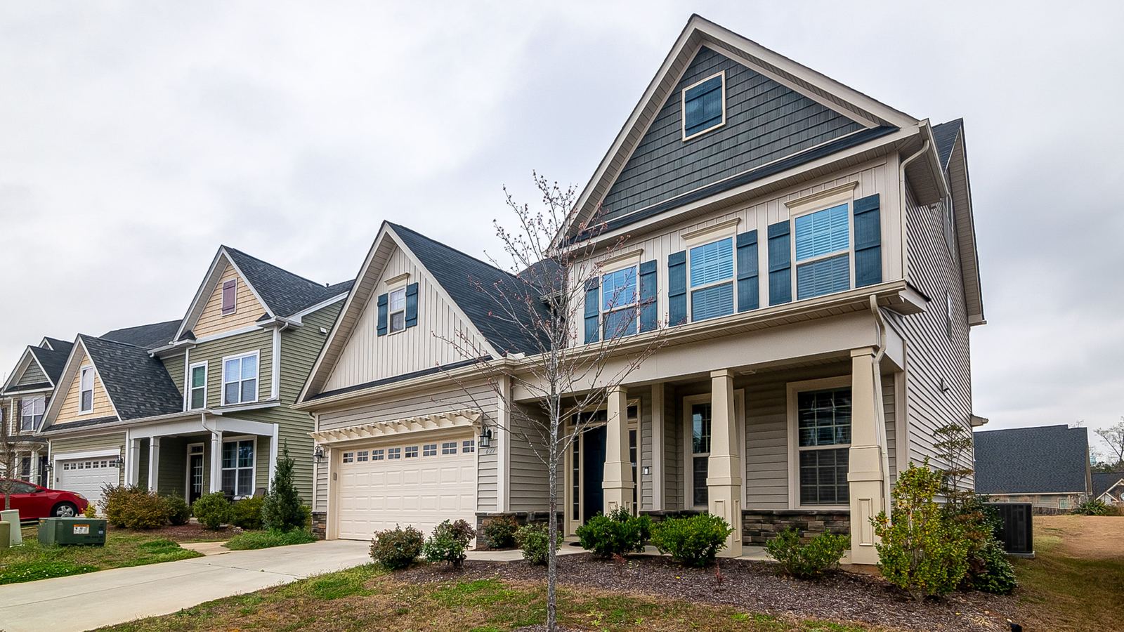 A row of suburban houses with driveways