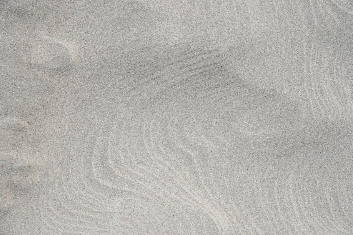A close-up of fine grey sand
