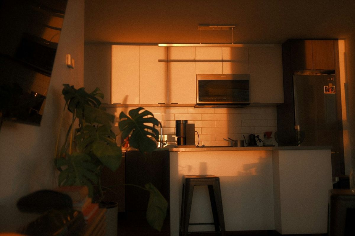 A kitchen lit by warm evening light