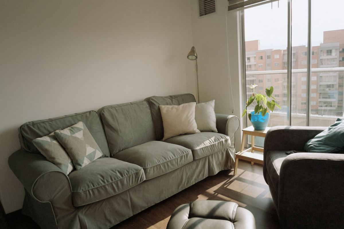 A living room with a sofa and an armchair
