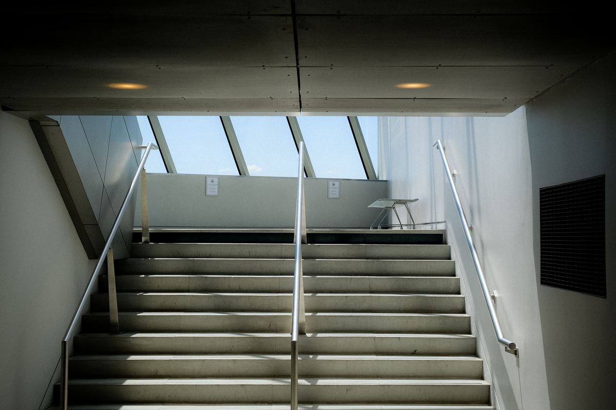 A staircase inside a building lit from above
