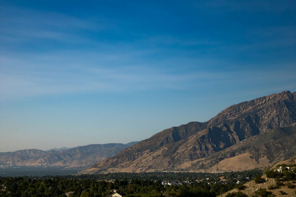 Distant mountains under a wide blue sky