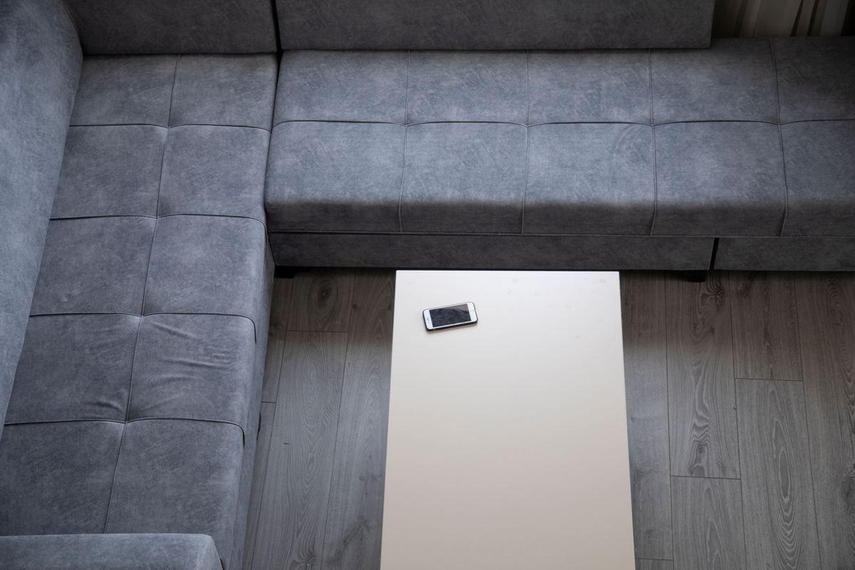 A smartphone on a low table in a minimalist living room