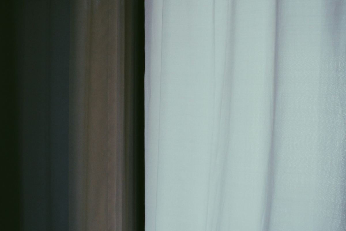 Soft white curtains lit by daylight