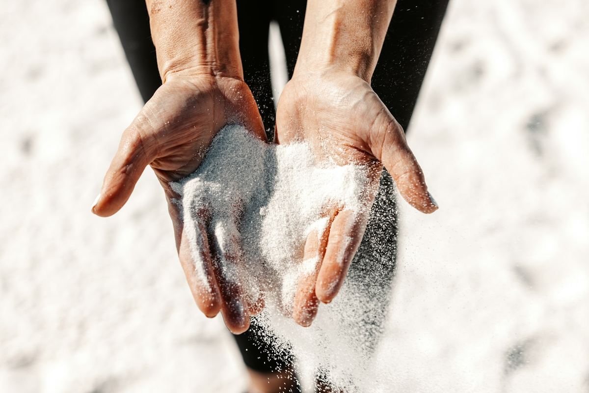Sand falling through a pair of open hands
