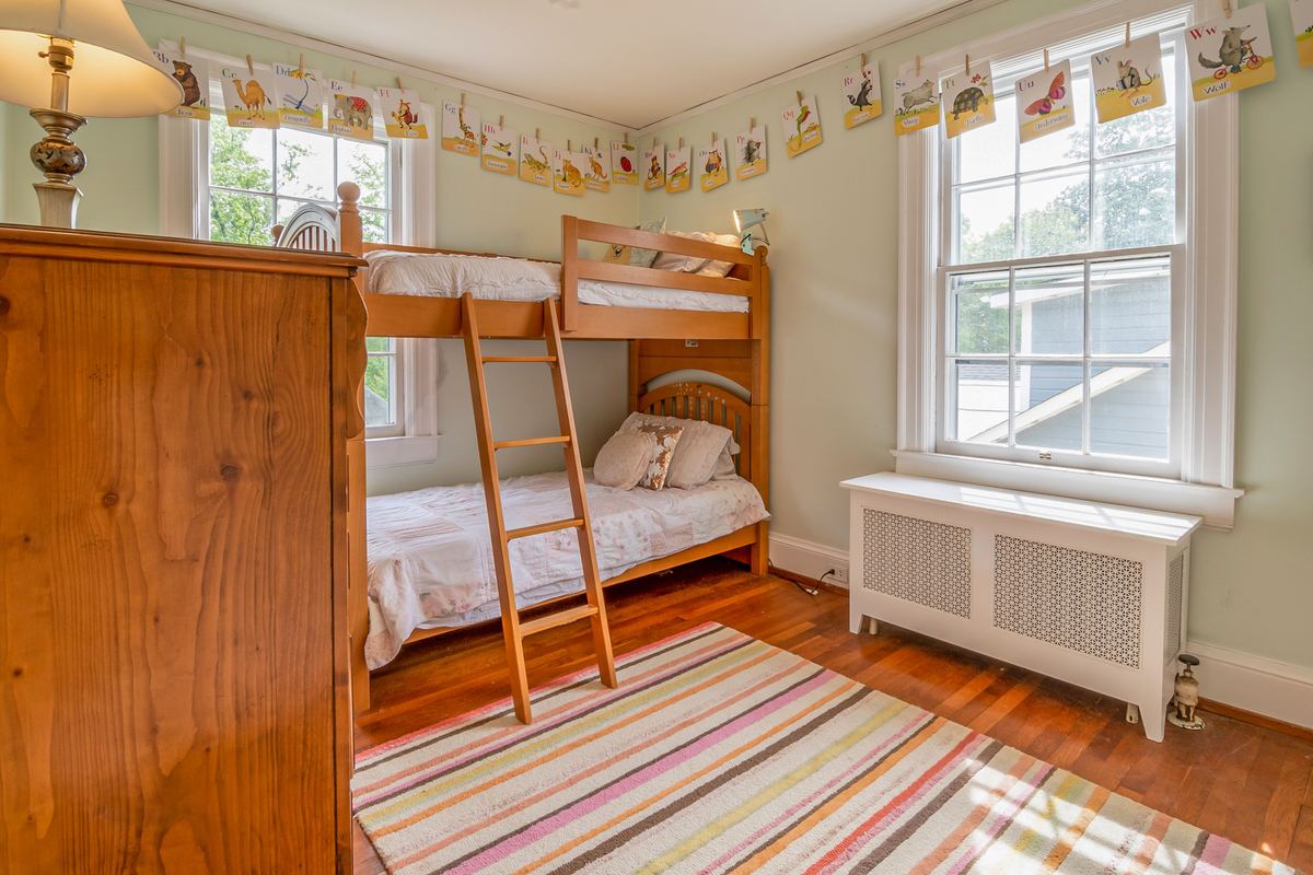 A children's bedroom with wooden bunk beds