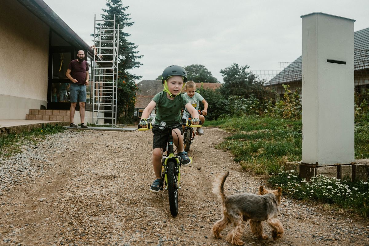 Two children cycling along a path