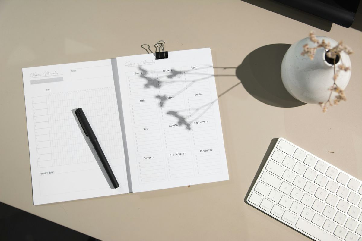 A black pen resting on a sheet of white paper
