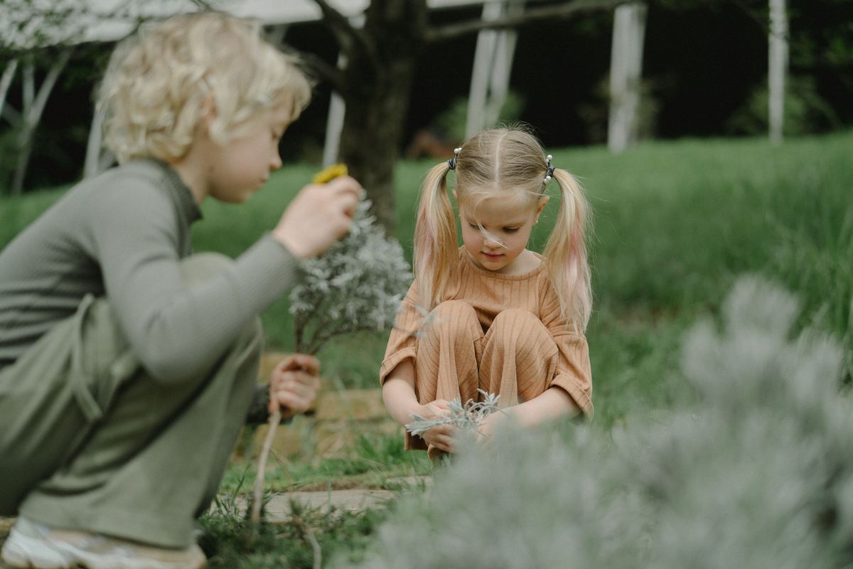 Two children playing together outdoors