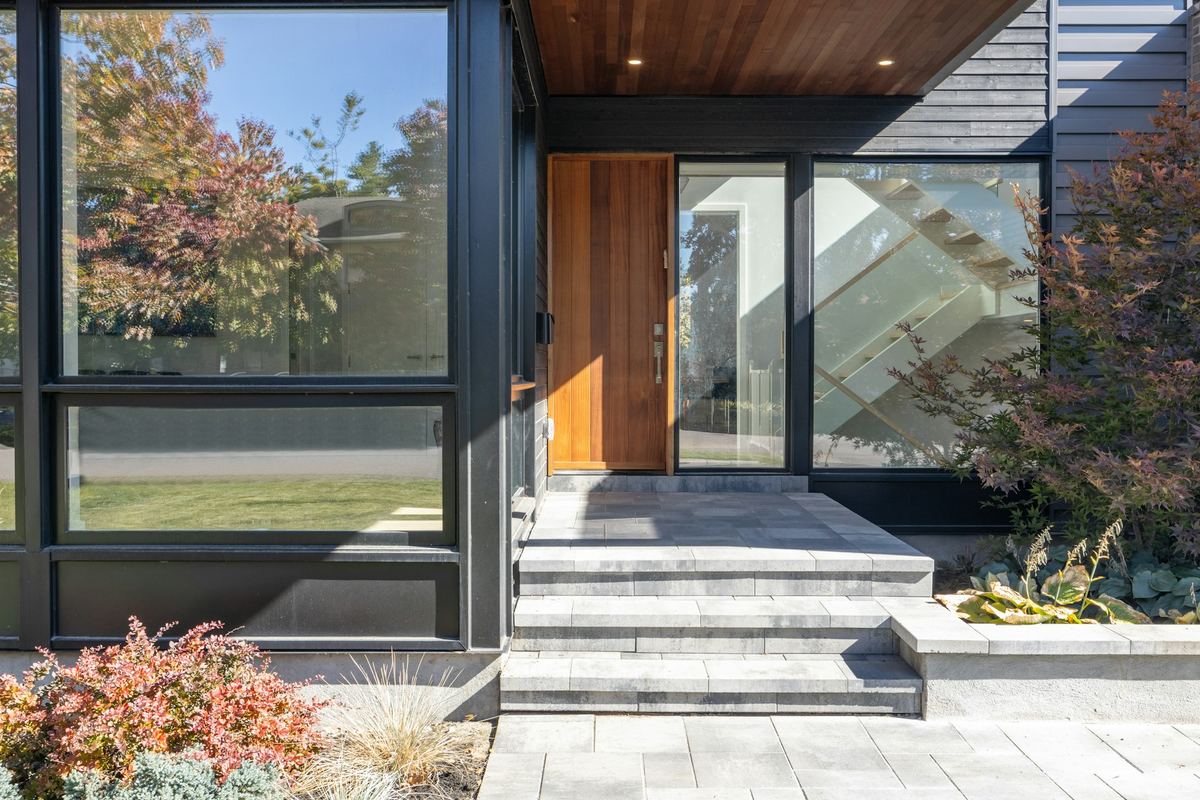 The entrance of a modern building with glass windows