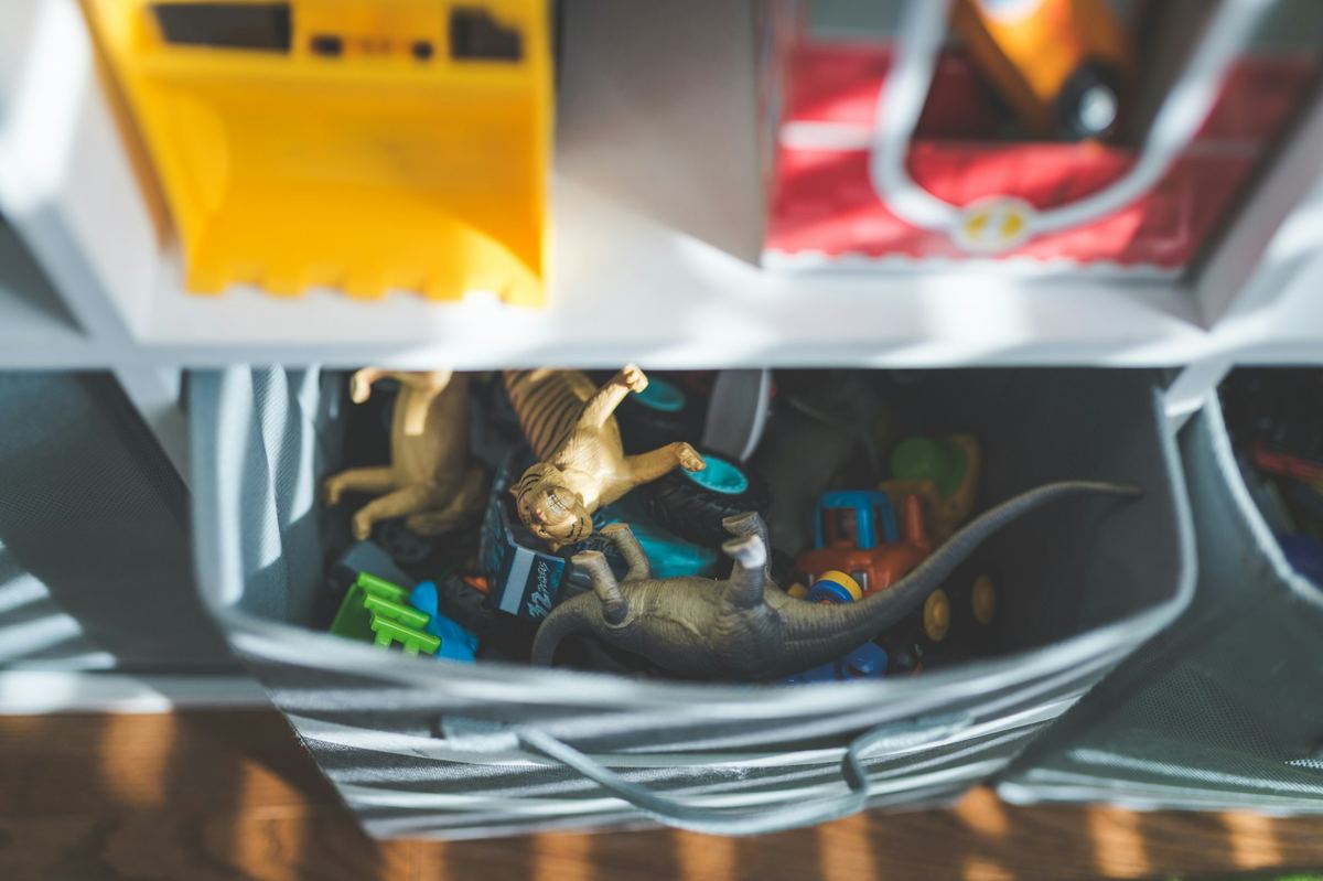 A close-up of small toys in a storage bin