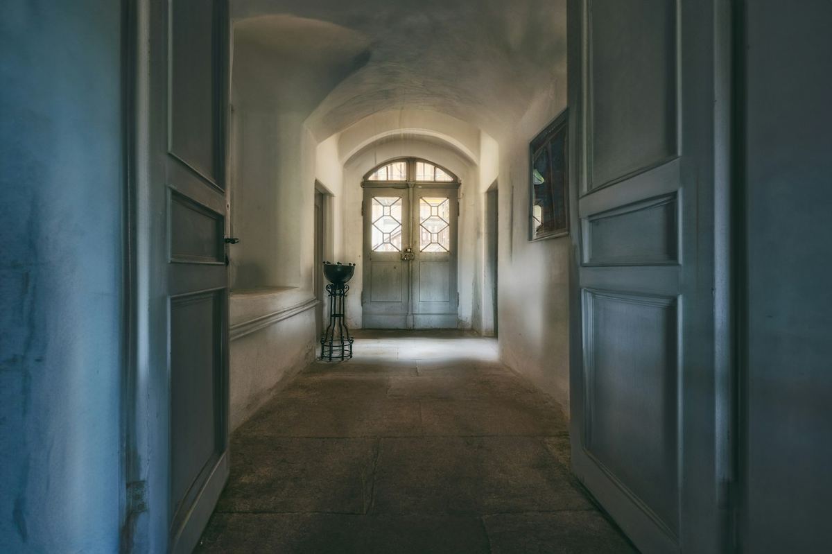 A hallway with doors and windows