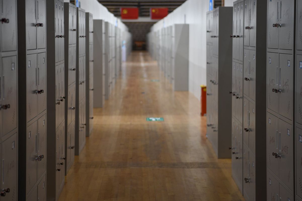 A long school corridor lined with metal lockers