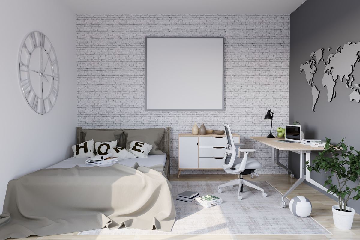 A bright bedroom with a desk and workspace